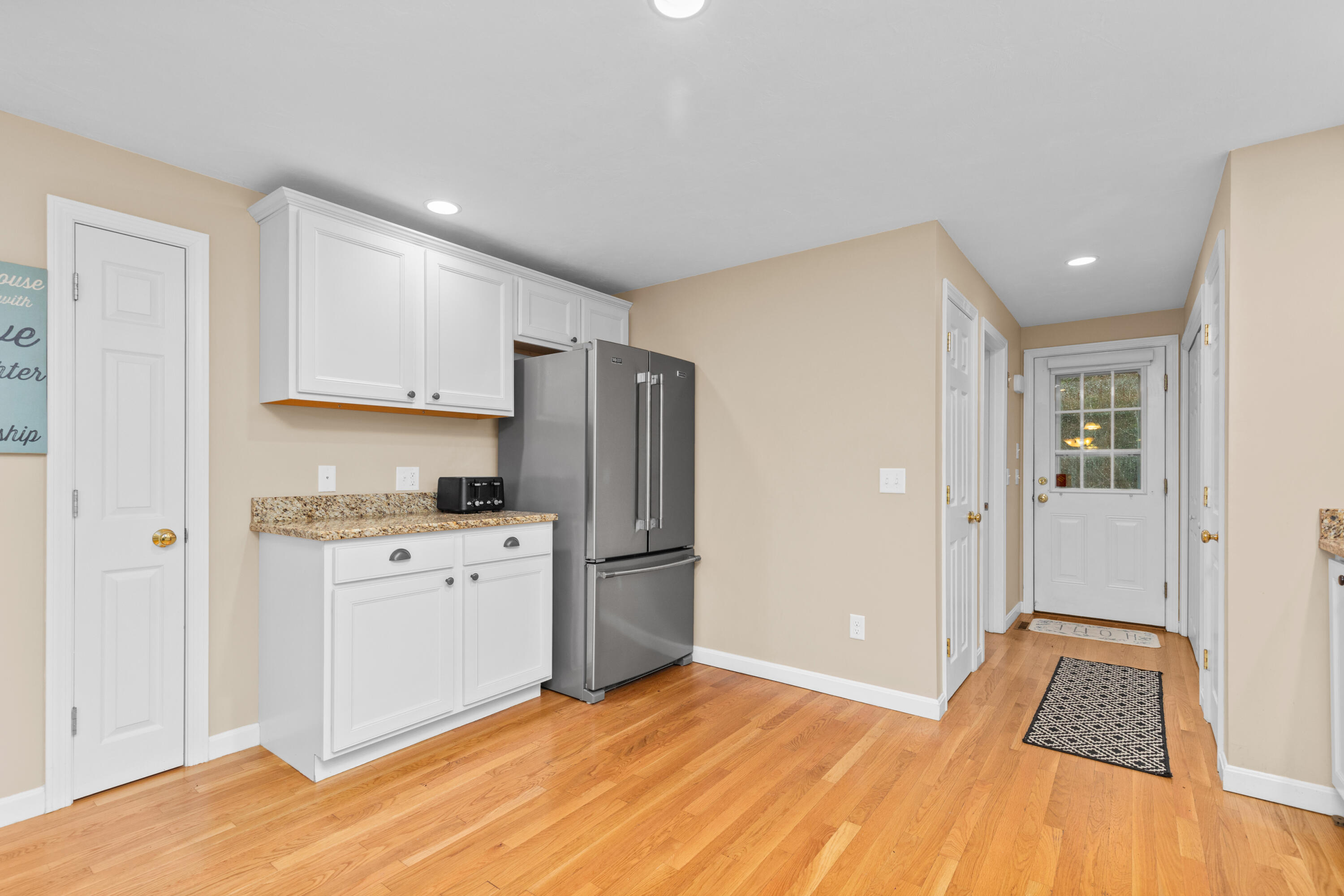 5 Baker Road Wellfleet, MA 02667 - Photo 7 of 30 a kitchen with granite countertop a refrigerator stove and sink