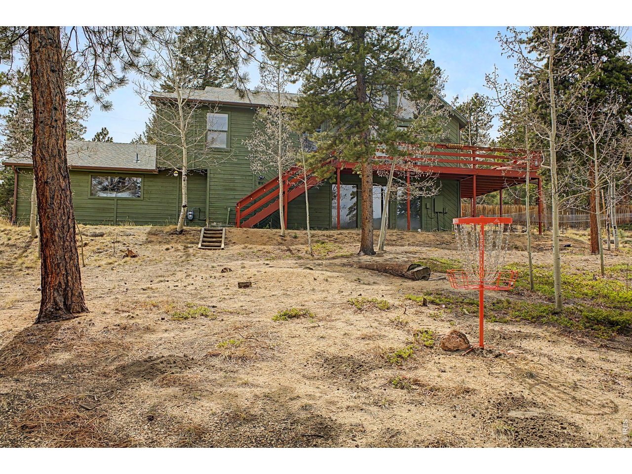 76 Highlands Drive Bailey, CO 80421 - Photo 3 of 49 a backyard of a house with portable swimming pool