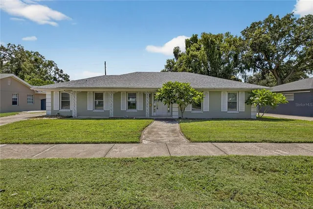 a view of a house with a yard