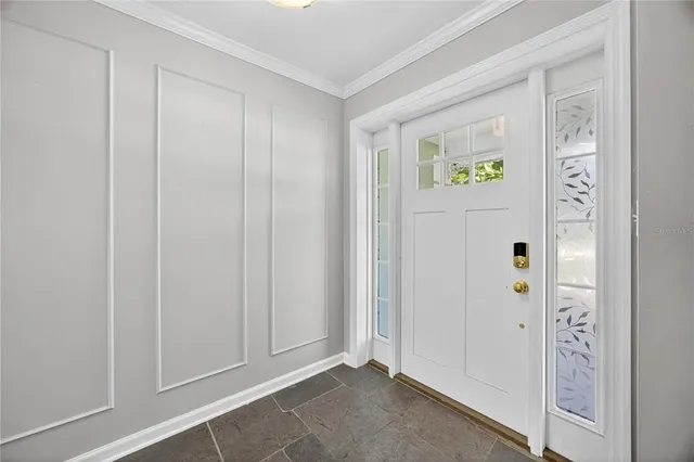 a view of an entryway with wooden floor