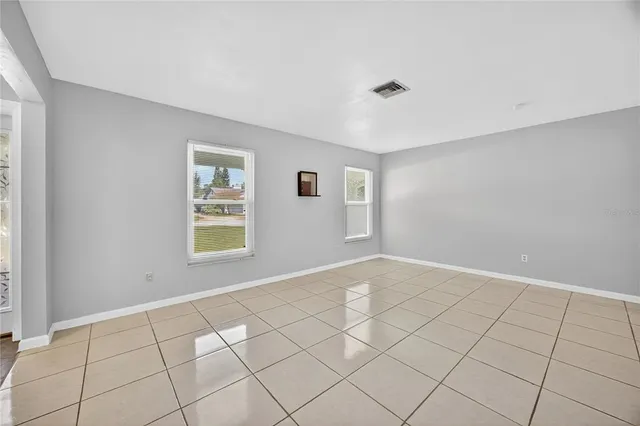 a view of an empty room and window