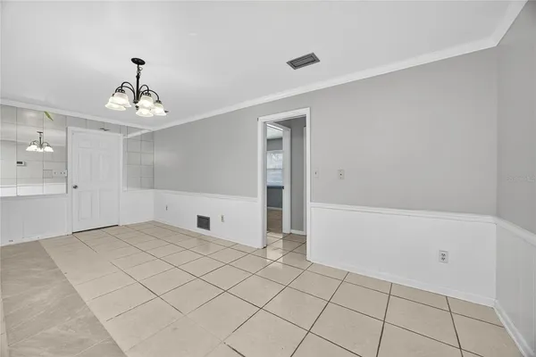 a view of a kitchen with a sink and a refrigerator in it