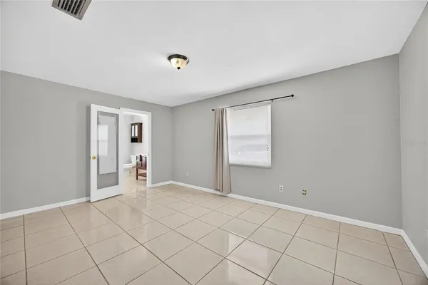 a view of an empty room and window