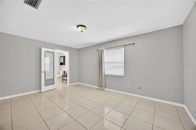 a view of an empty room and window