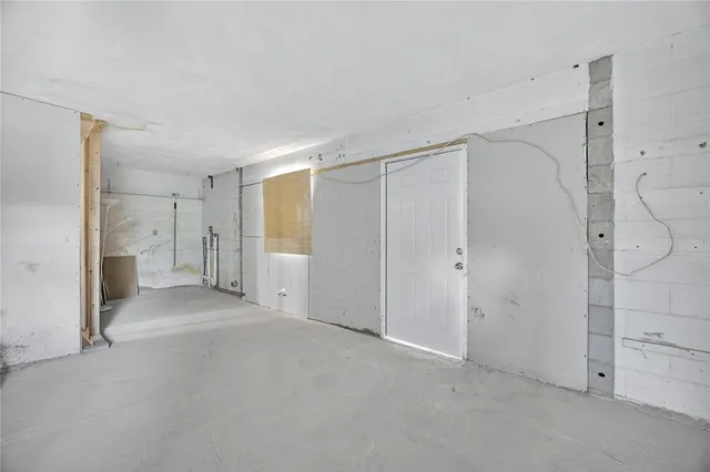 a big room with closet and a chandelier