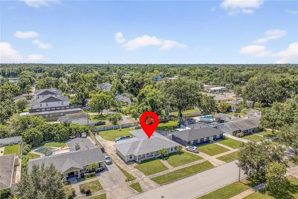 an aerial view of a house with outdoor space