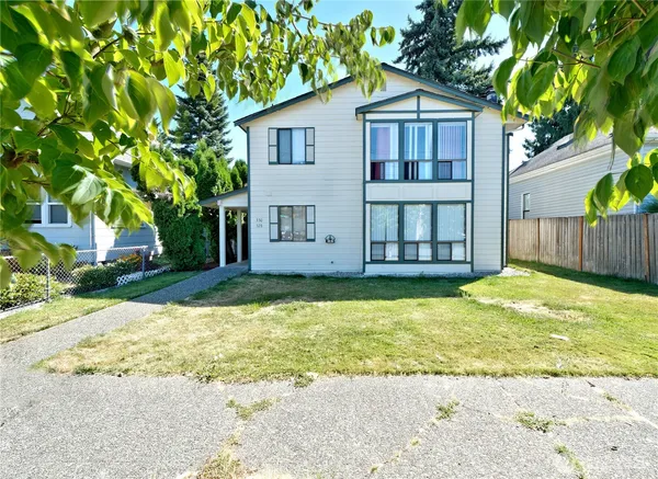 a front view of a house with a yard