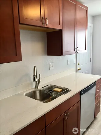 a kitchen with a sink and cabinets