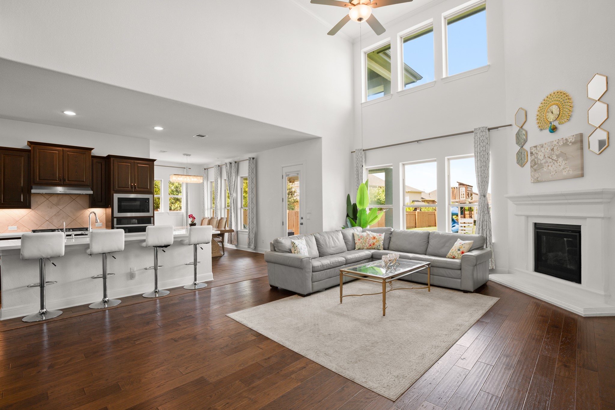 2817 Gatlin Cove Leander, TX 78641 - Photo 39 of 40 Inside you will find multiple spaces for living and dining including this spectacular, sunlit open floor plan for the living room, kitchen, and dining area.