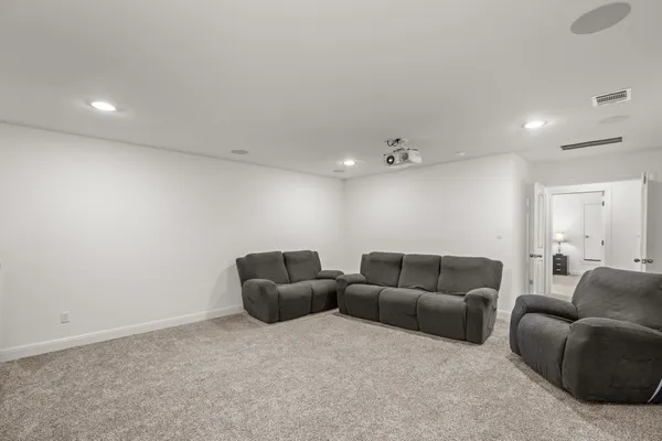 a view of an empty room with a ceiling fan