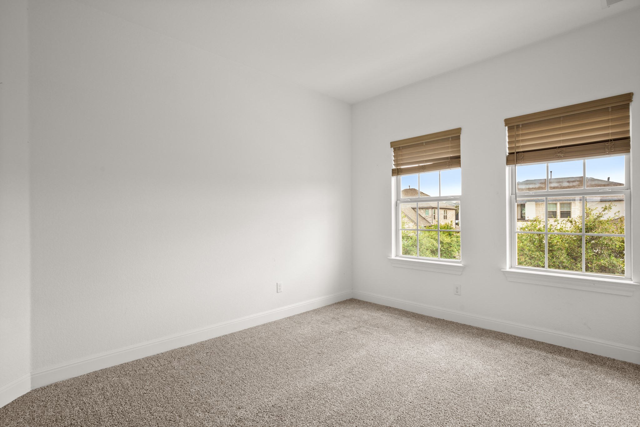 2817 Gatlin Cove Leander, TX 78641 - Photo 31 of 40 All three second floor bedrooms offer excellent natural light, cozy carpeting, and closet storage.