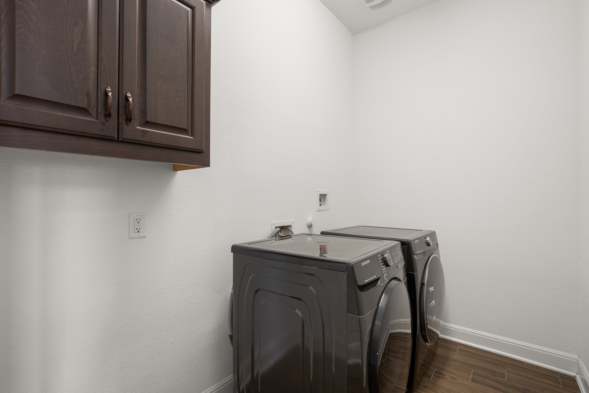 2817 Gatlin Cove Leander, TX 78641 - Photo 34 of 40 The main floor laundry room comes with cabinetry storage. There is also a whole home water filtration system and separate RO system under the kitchen sink.