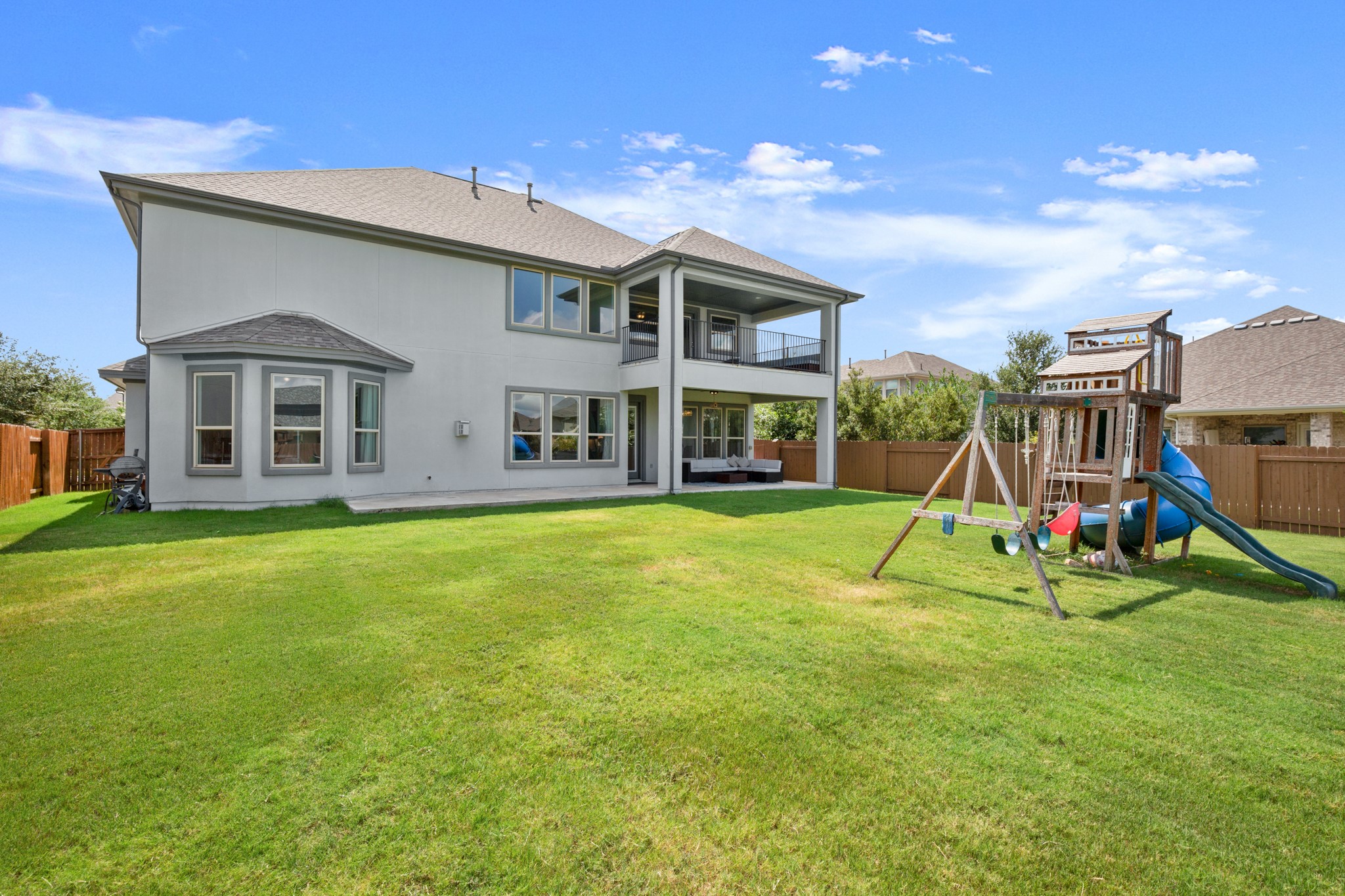 2817 Gatlin Cove Leander, TX 78641 - Photo 35 of 40 Also enjoy covered outdoor living on the patio below the balcony with view of your sprawling fenced-in backyard.