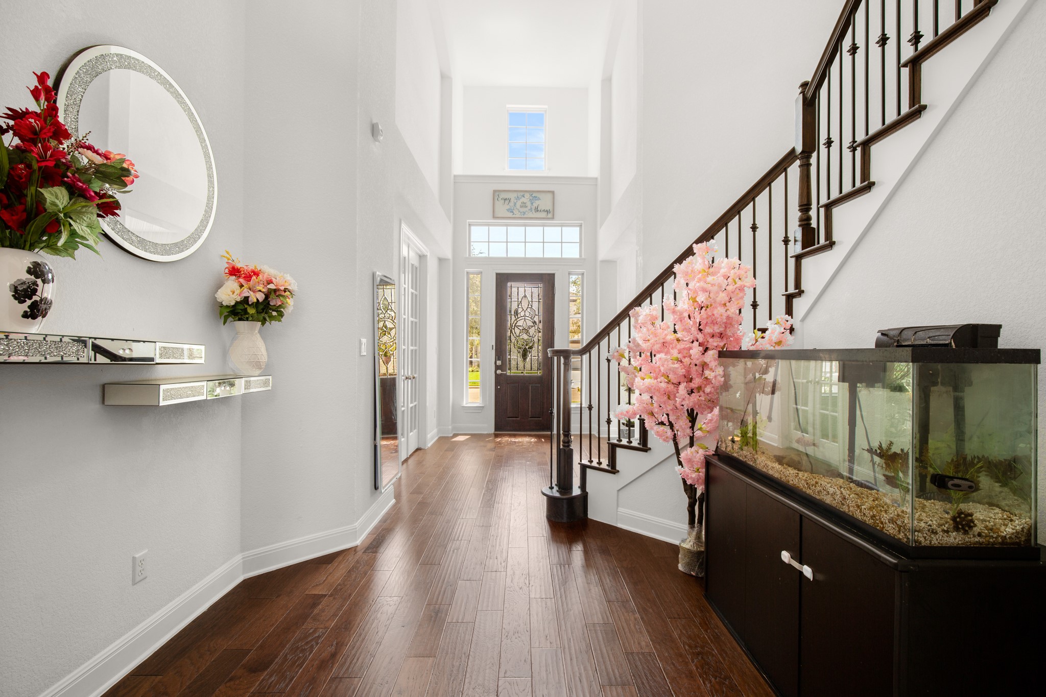 2817 Gatlin Cove Leander, TX 78641 - Photo 9 of 40 A grand entry foyer welcomes you home under soaring two-story ceilings open to the second floor above with a gorgeous open staircase and a dramatic rotunda.