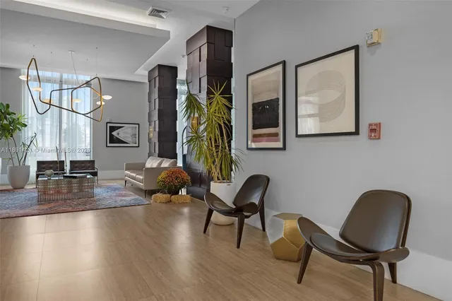 a work room with furniture and wooden floor