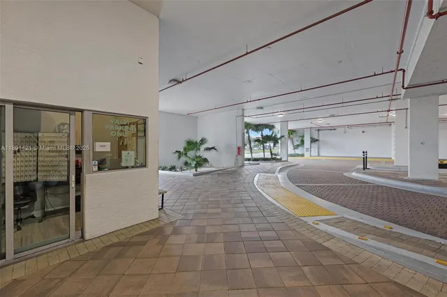 a view of a kitchen with a sink and a living room