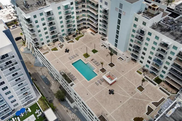 an aerial view of a multi story parking building