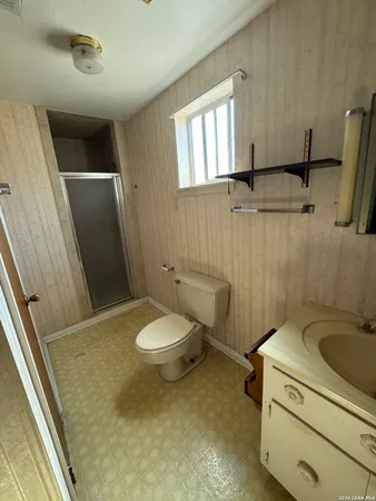 a bathroom with a sink and toilet