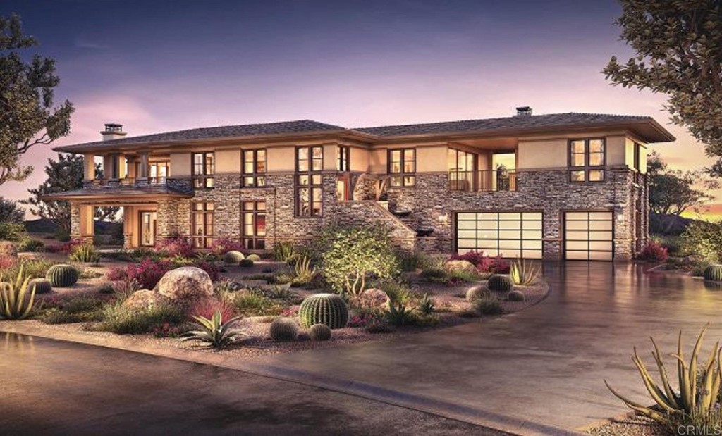 a front view of a house with outdoor space