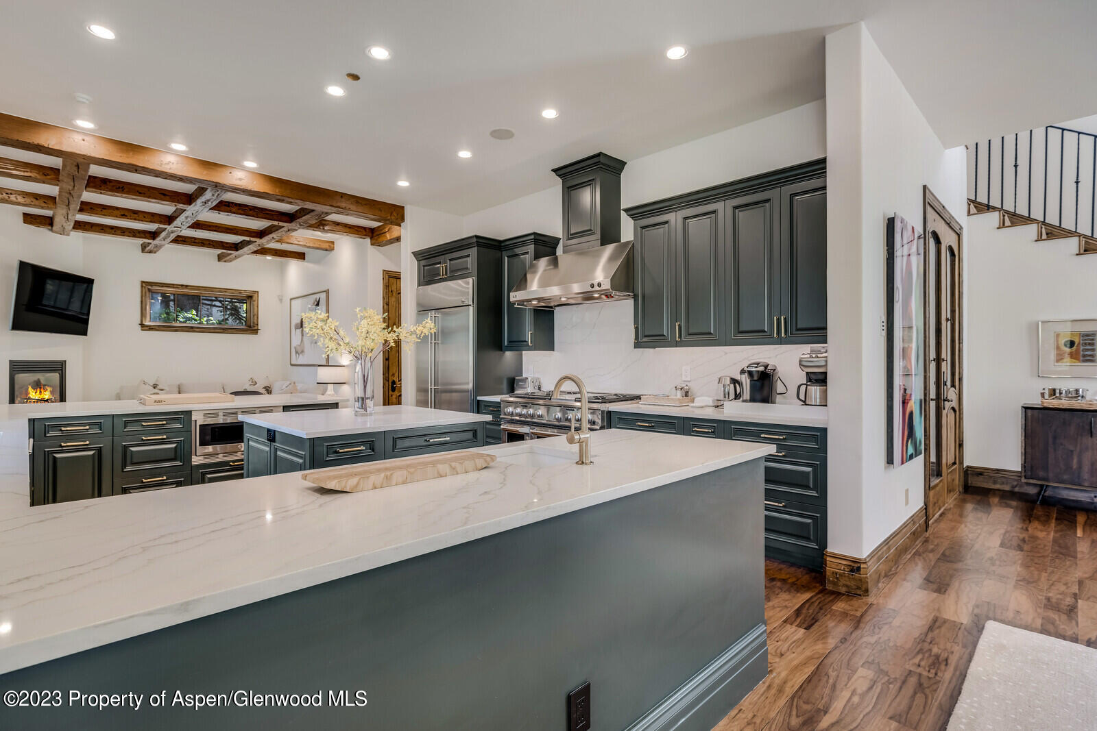 70 River Bend Road Snowmass, CO 81654 - Photo 16 of 70 a large kitchen with stainless steel appliances a large counter top a stove a sink and a refrigerator
