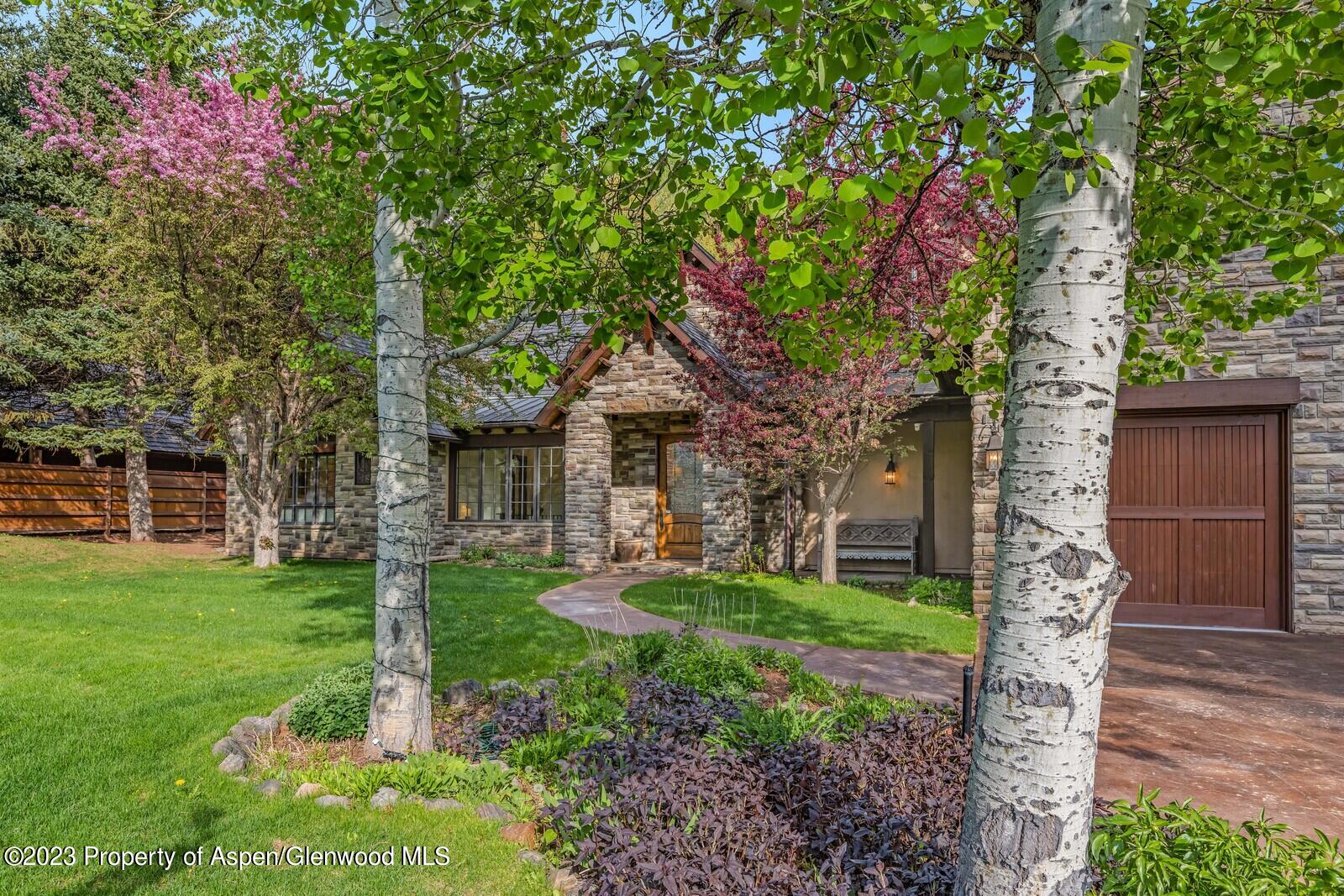 70 River Bend Road Snowmass, CO 81654 - Photo 26 of 70 a front view of a house with garden