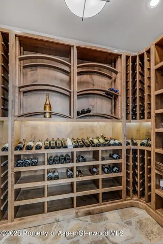 a bathroom with a granite countertop sink mirror and a bathtub