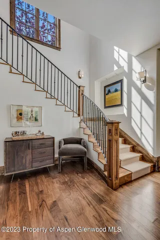 a living room with furniture ceiling fan and a window