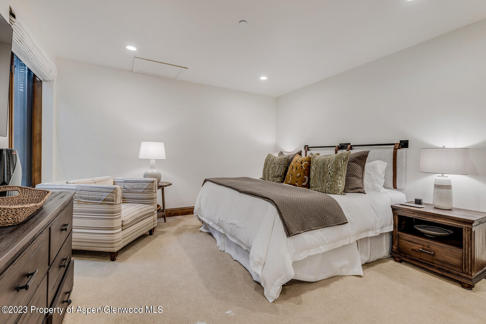 70 River Bend Road Snowmass, CO 81654 - Photo 37 of 70 a bedroom with a bed and a night stand