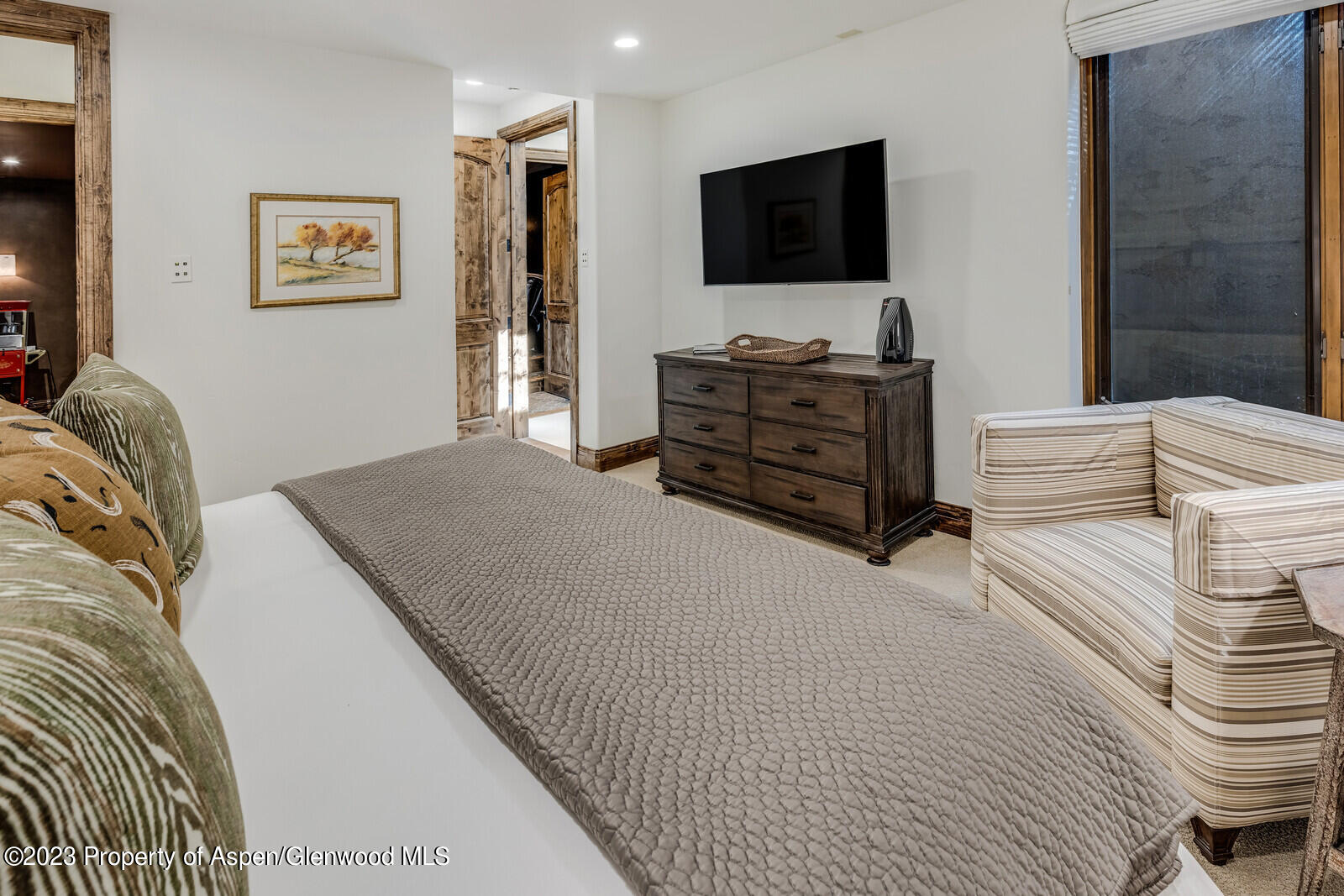 70 River Bend Road Snowmass, CO 81654 - Photo 38 of 70 a living room with furniture and a flat screen tv