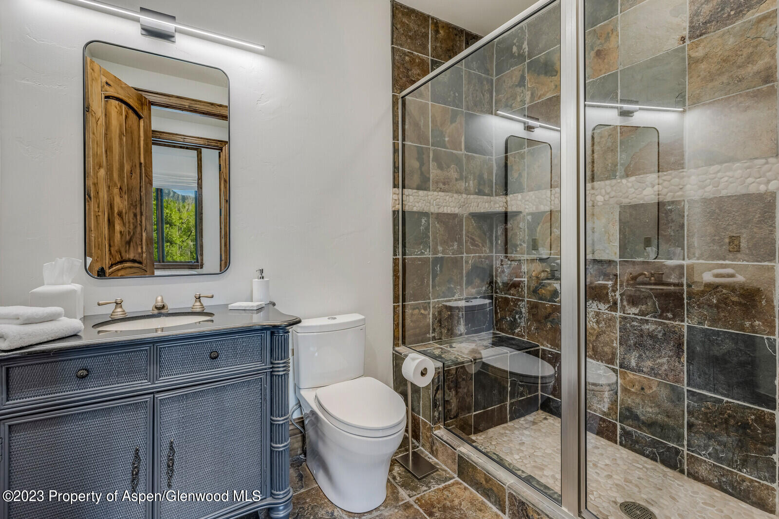 70 River Bend Road Snowmass, CO 81654 - Photo 44 of 70 a bathroom with a toilet sink vanity and mirror