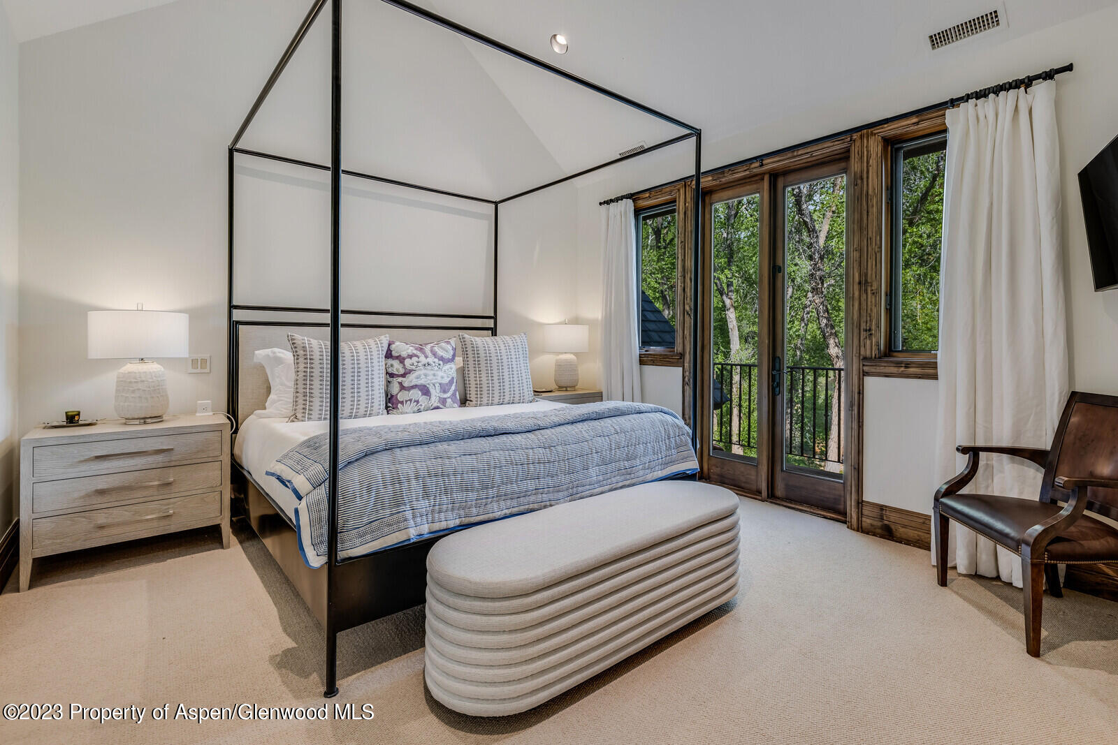 70 River Bend Road Snowmass, CO 81654 - Photo 45 of 70 a bedroom with a bed and large windows