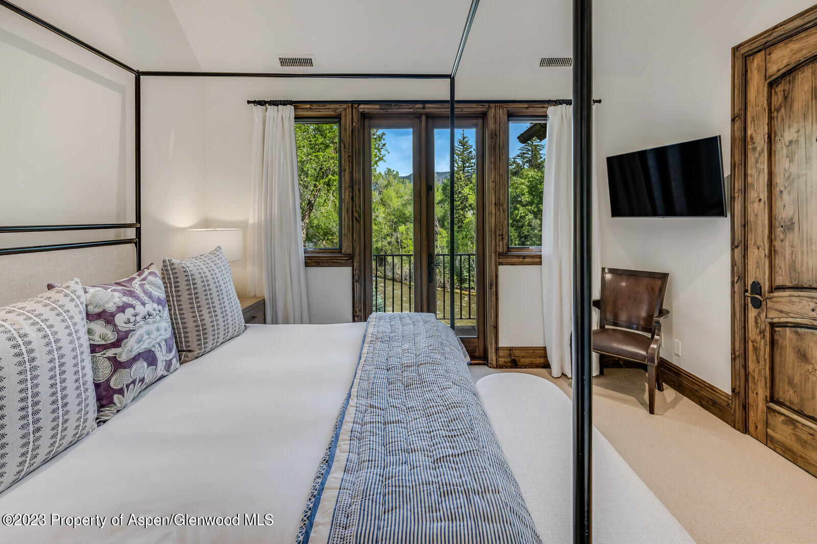70 River Bend Road Snowmass, CO 81654 - Photo 46 of 70 a bed sitting in a bedroom next to a window