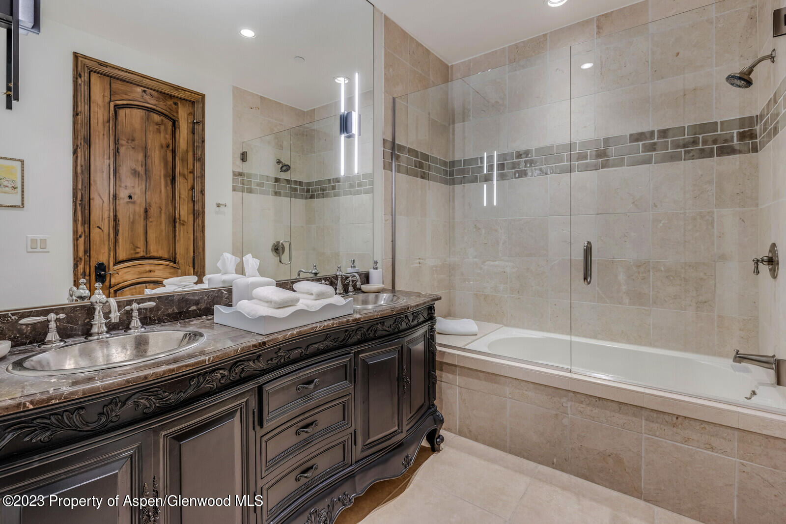 70 River Bend Road Snowmass, CO 81654 - Photo 47 of 70 a bathroom with a granite countertop sink mirror and a bathtub