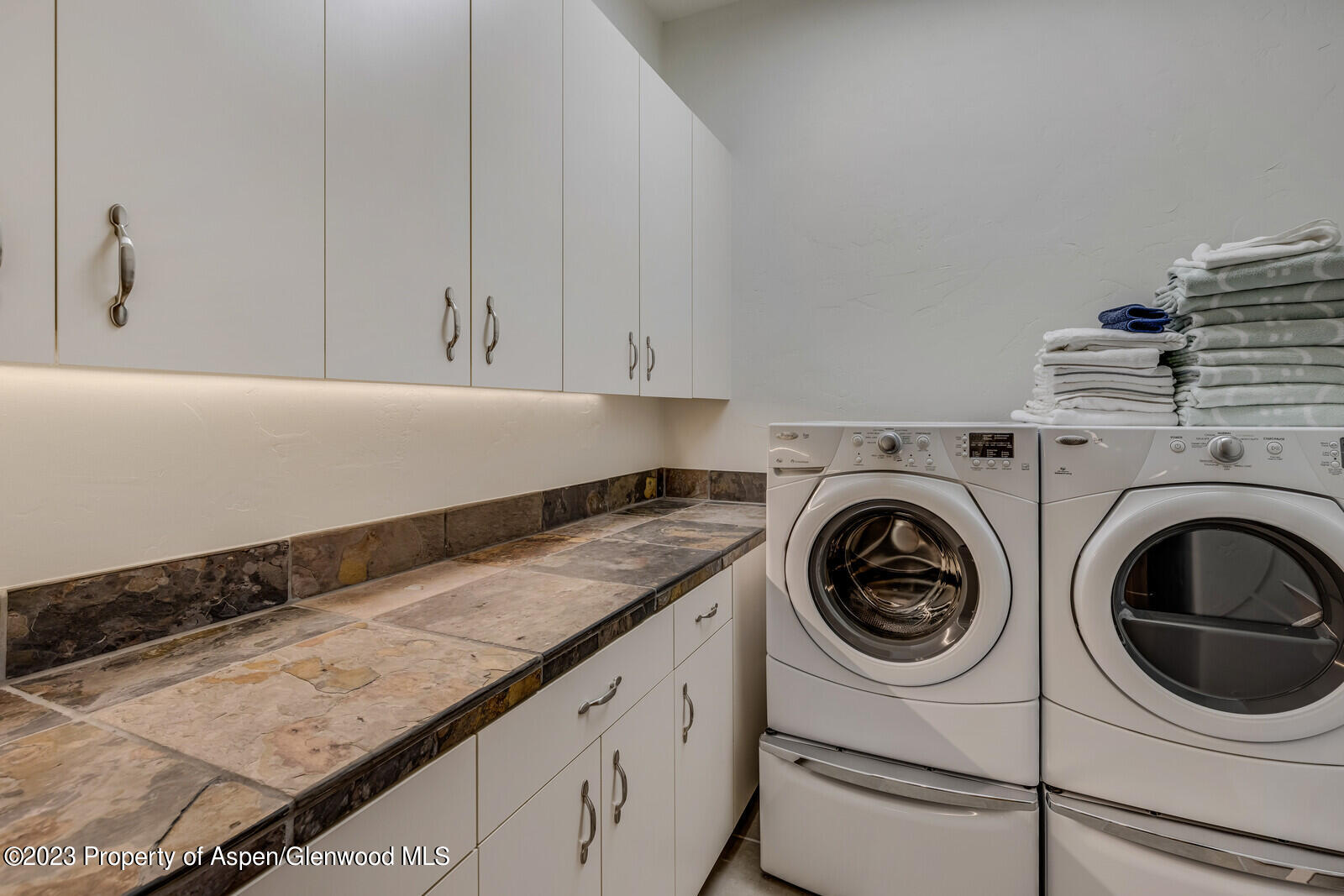 70 River Bend Road Snowmass, CO 81654 - Photo 54 of 70 a utility room with sink dryer and washer