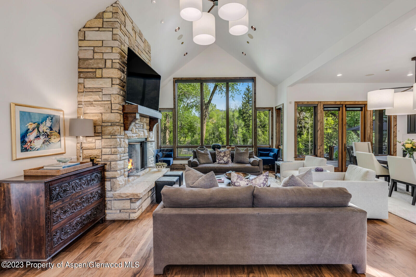 70 River Bend Road Snowmass, CO 81654 - Photo 7 of 70 a living room with furniture a large window and a chandelier