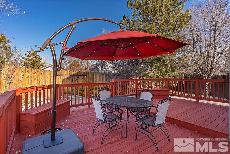 5849 Walnut Creek Road Reno, NV 89523 - Photo 18 of 20 a view of balcony with outdoor seating and wooden floor