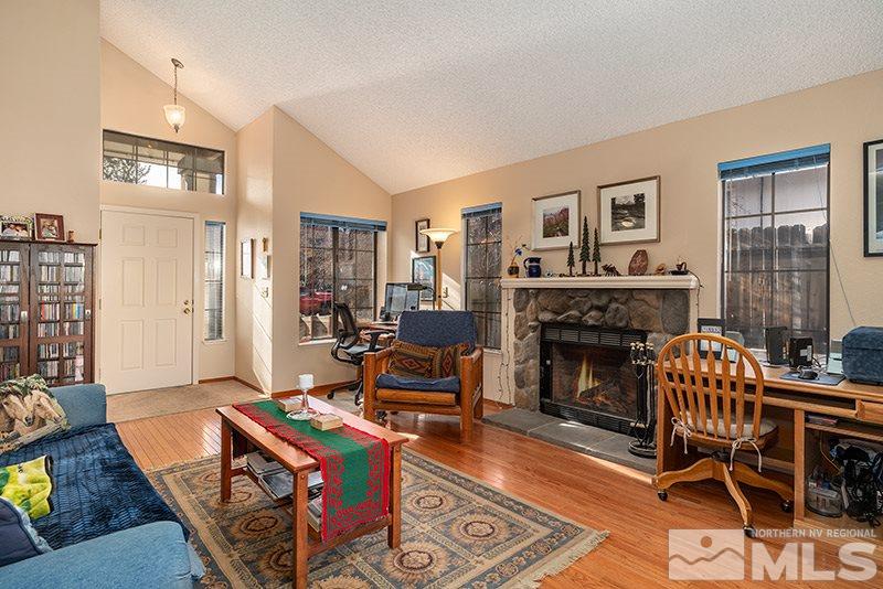5849 Walnut Creek Road Reno, NV 89523 - Photo 5 of 20 a living room with furniture and a fireplace