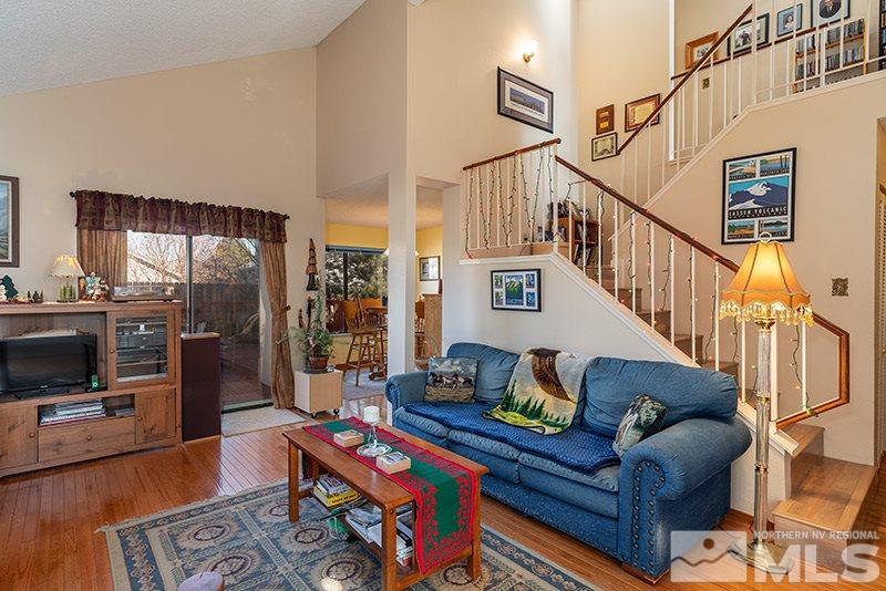 5849 Walnut Creek Road Reno, NV 89523 - Photo 7 of 20 a living room with furniture fireplace and a flat screen tv