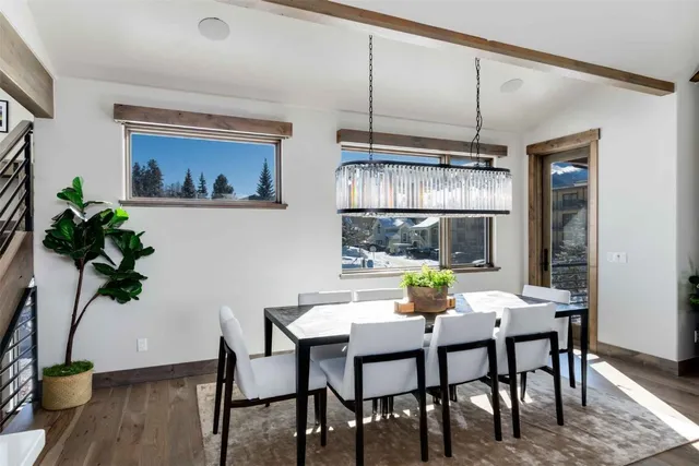 a view of a dining room with furniture window and wooden floor