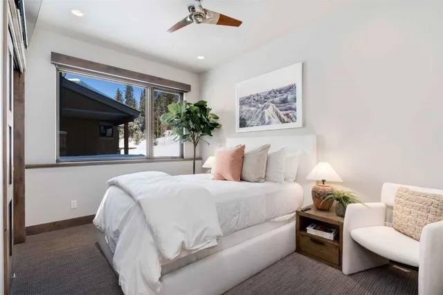 a bedroom with a large bed and a couch