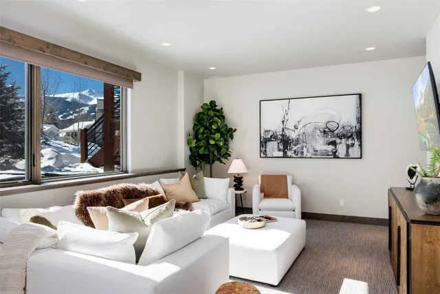 a living room with furniture and window