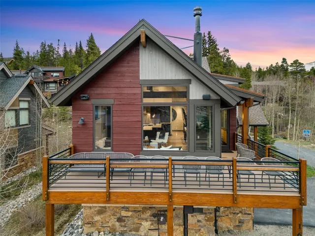 a front view of a house with plants