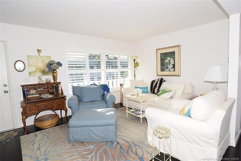 2929 Southeast Ocean Boulevard, Unit L8 Stuart, FL 34996 - Photo 16 of 32 a living room with furniture and a window
