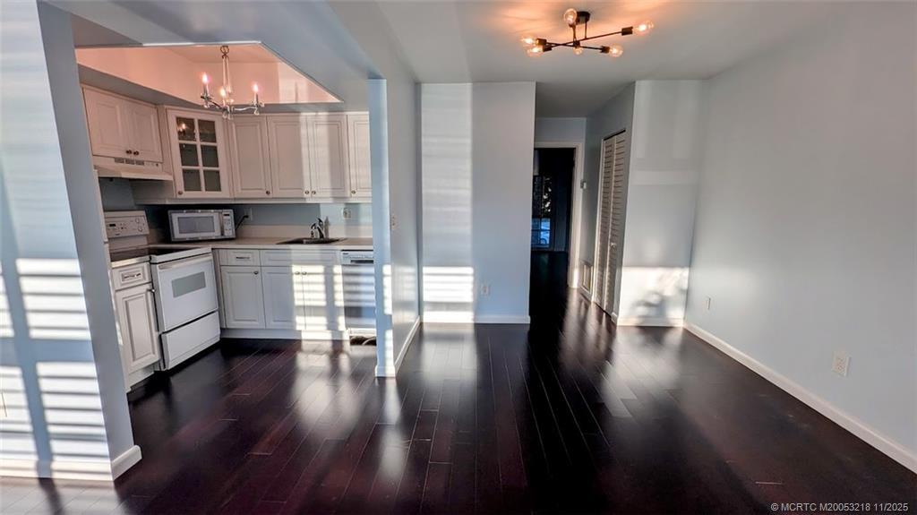 2929 Southeast Ocean Boulevard, Unit L8 Stuart, FL 34996 - Photo 20 of 32 empty living room 1