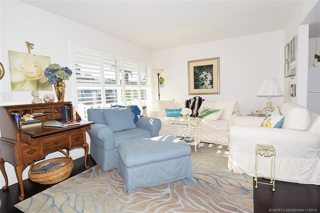 2929 Southeast Ocean Boulevard, Unit L8 Stuart, FL 34996 - Photo 2 of 32 a living room with furniture and a window