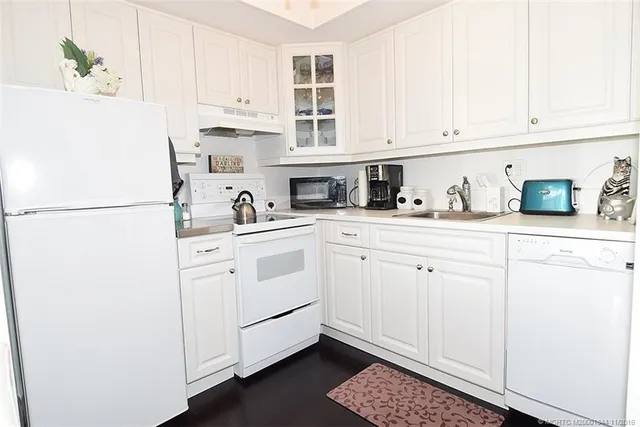 a bathroom with a granite countertop sink mirror and vanity