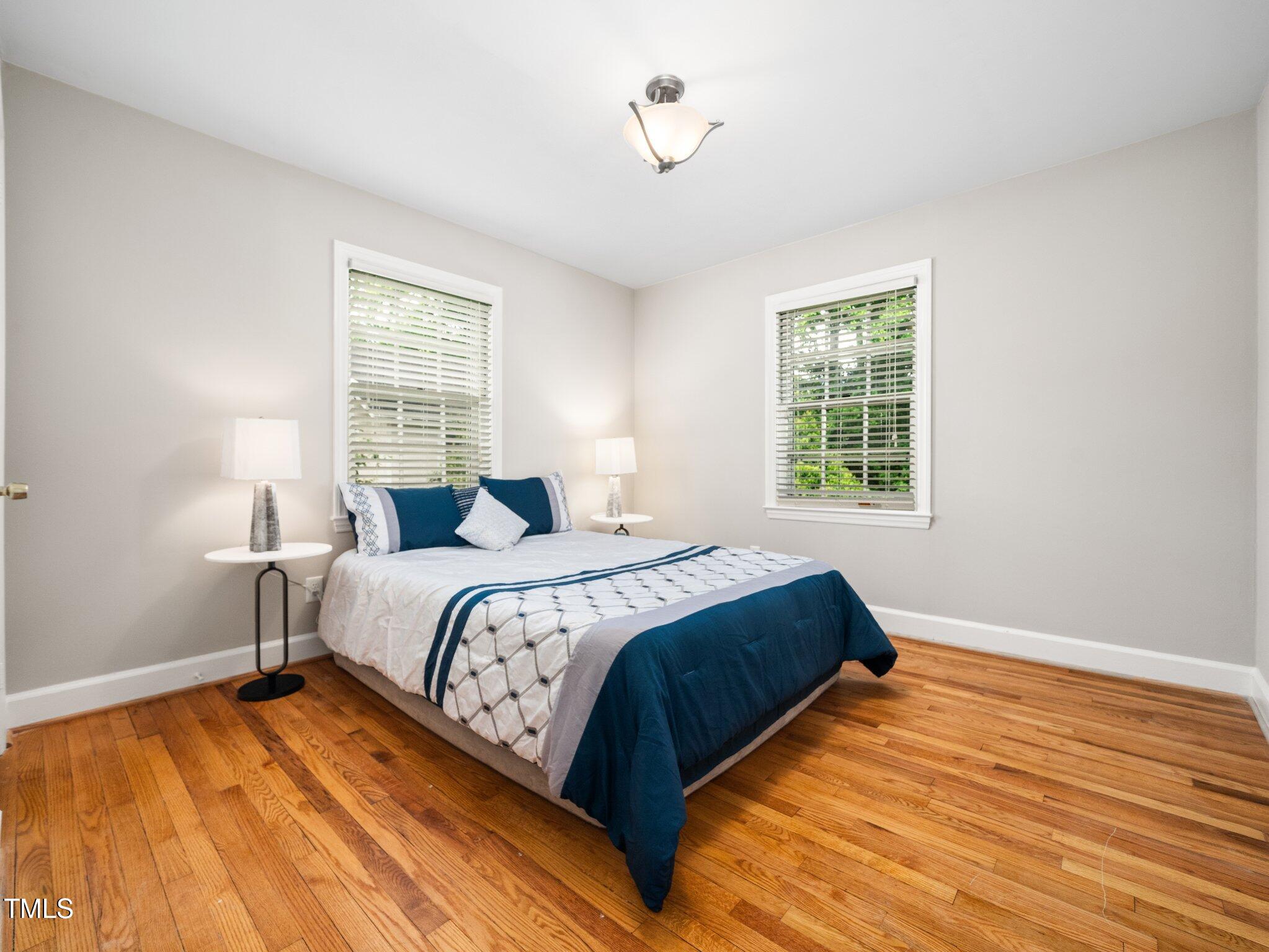 1313 Ridge Road Raleigh, NC 27607 - Photo 22 of 36 a bedroom with bed and window