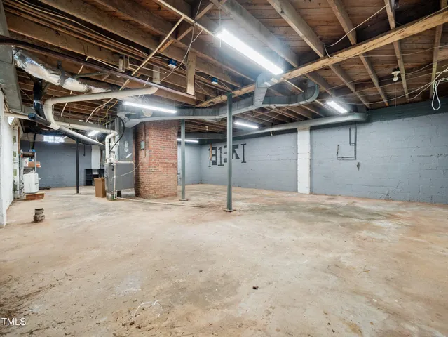 a view of empty room with wooden ceiling