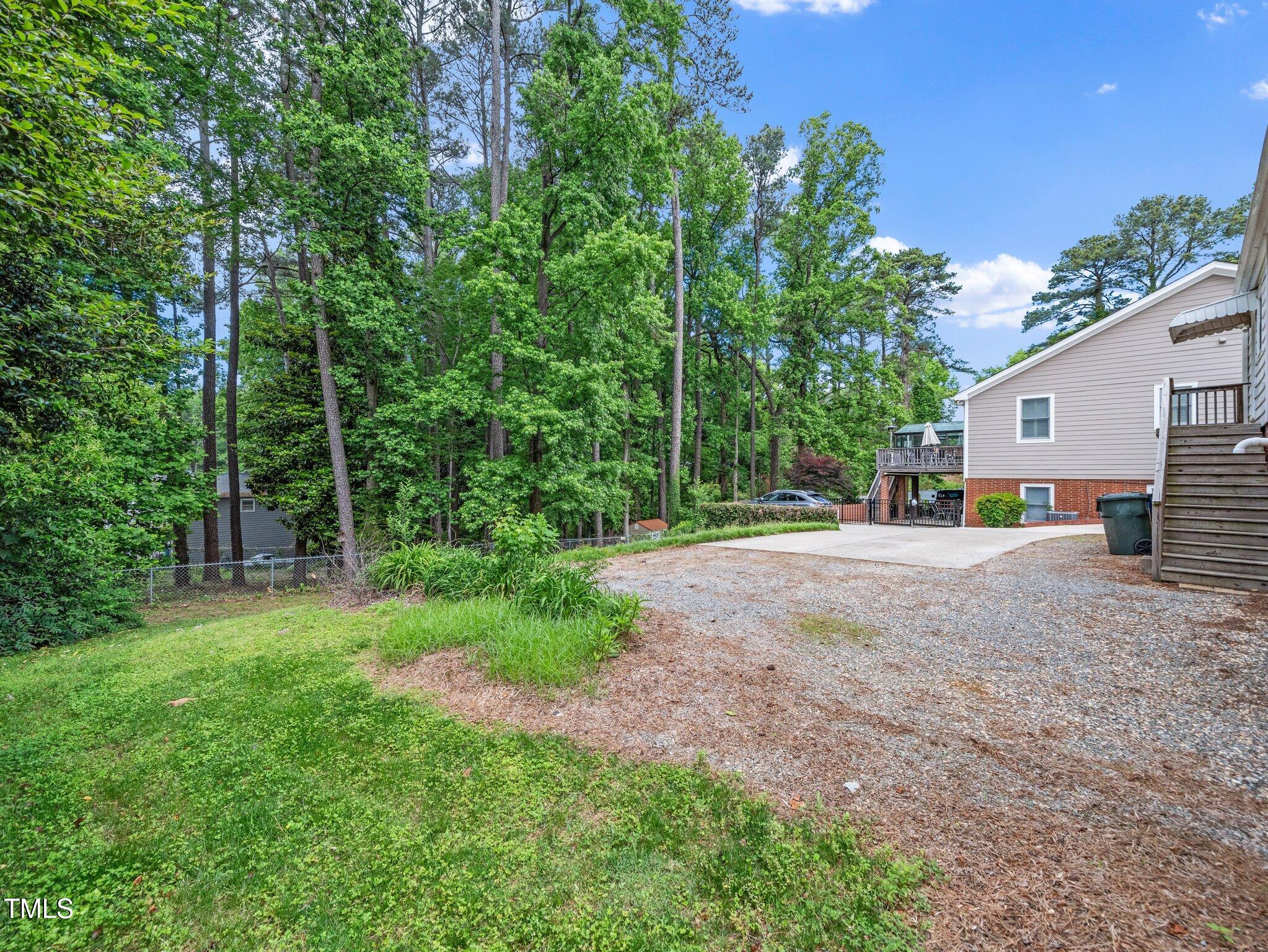 1313 Ridge Road Raleigh, NC 27607 - Photo 27 of 36 a view of a road with large trees