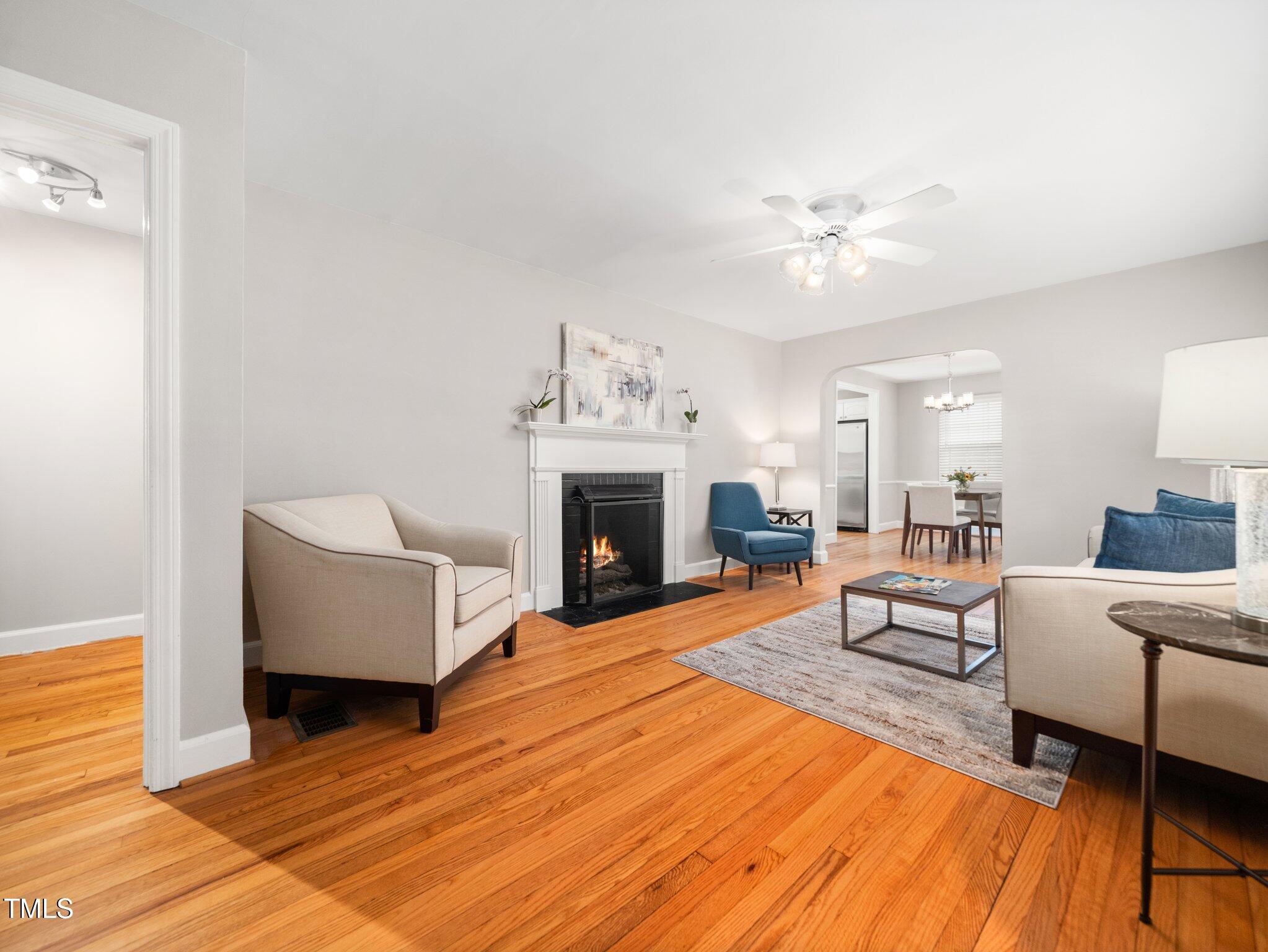 1313 Ridge Road Raleigh, NC 27607 - Photo 3 of 36 a living room with furniture and a fireplace